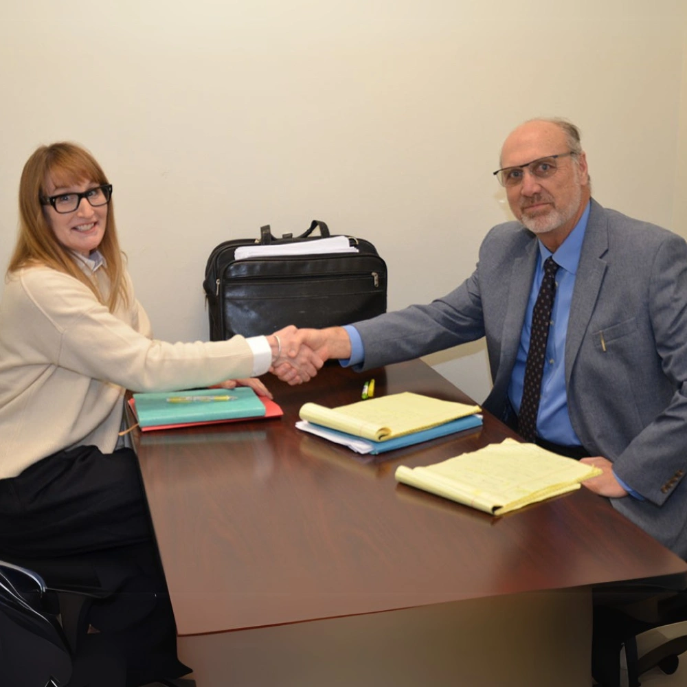 Heiman meeting a client in the Frisco Law Firm offices - mobile